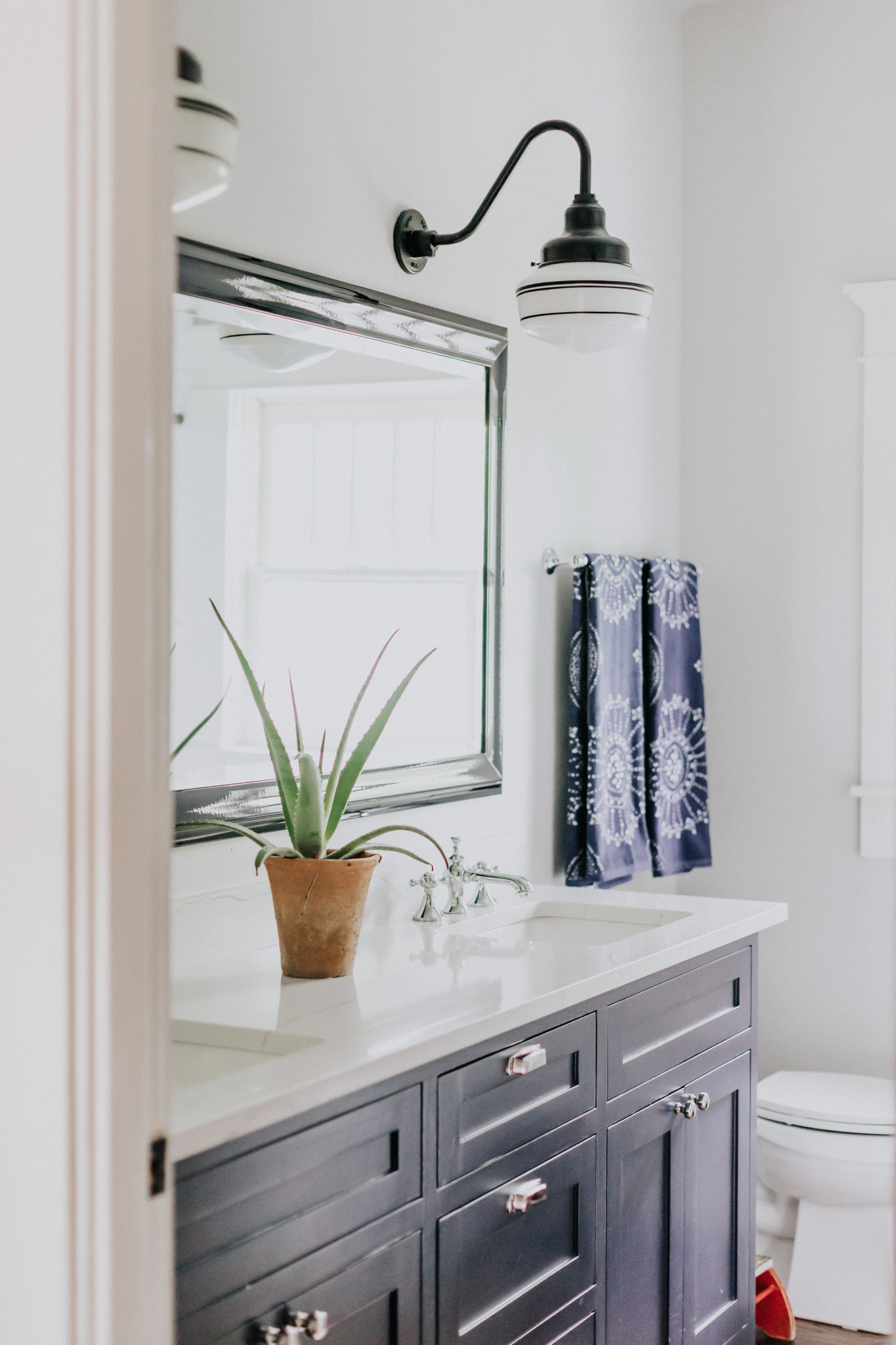 Primary Schoolhouse Gooseneck Light | Photo Courtesy of Kate Thacker Homes, Christina Childress Photography, Emiliano Zazueta, and River Oak Build