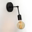 Downtown Minimalist Adjustable Sconce, 100-Black | Shown with Elva Tala Bulb Downtown Minimalist Adjustable Sconce, 100-Black | Shown with Elva Tala Bulb