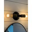 Downtown Minimalist Double Sconce,  Mounting in 100-Black, Cup in 998-Natural Weathered Brass, (2) Victorian 40W Edison Bulbs | Photo Courtesy of John Colaneri Downtown Minimalist Double Sconce,  Mounting in 100-Black, Cup in 998-Natural Weathered Brass, (2) Victorian 40W Edison Bulbs | Photo Courtesy of John Colaneri