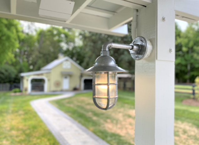 Industrial Farmhouse Lighting Highlights Exterior Renovation   Industrial Guard Sconce 975 Galvanized Flared TGG RibbedGlass5 635x464 