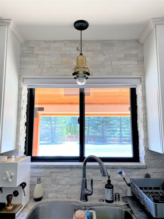 image0 residential interior kitchen Brewster Pendant Light 998 Weathered Brass 100 Black cotton twist Clear Glass