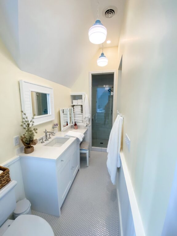 IMG 4593 residential interior bathroom lighting primary schoolhouse chain hung pendant small opaque 715 Delphite Blue 200 White chain Triple painted band