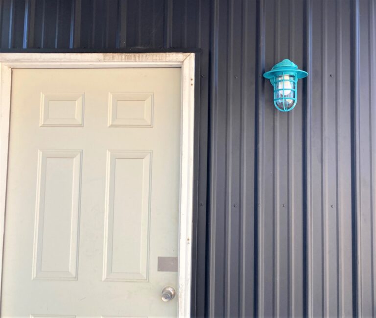 IMG 0011 commercial exterior lighting Industrial Static Sconce 390 Teal Flared Shade Cast Guard 390 Teal Clear Glass