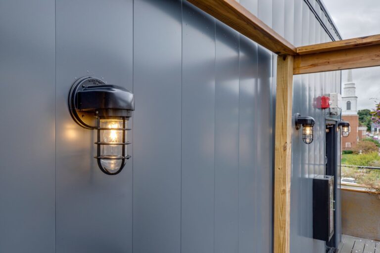 IMG 5526 fused streamline industrial guard sconce atomic 100 black CGG standard cast guard clear glass commercial exterior on