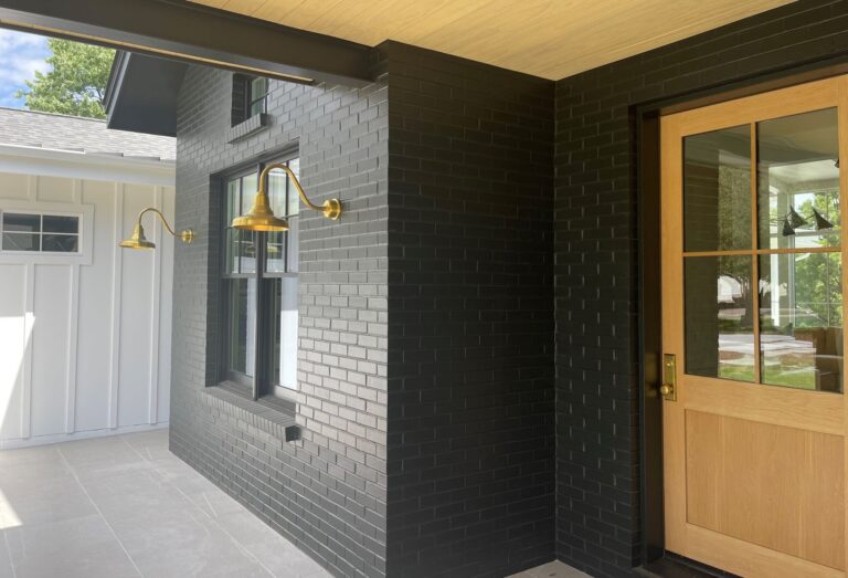 IMG 0387 residential exterior lighting porch Union Gooseneck 12in 997 Raw Brass G15arm Brass BP Hex Cover