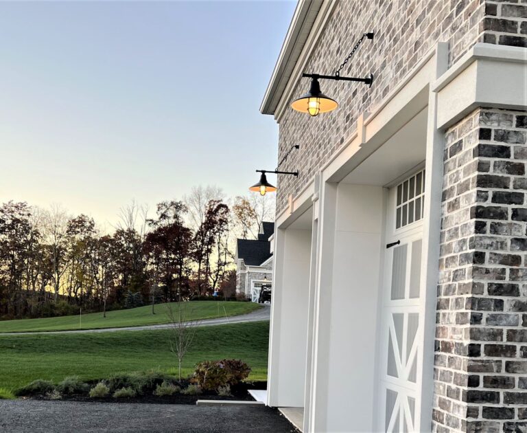 RESIZE IMG 3823 residential exterior lighting on garage Aero Gooseneck 16in 100 Black G64arm Heavy Duty Cast Guard Frosted Glass