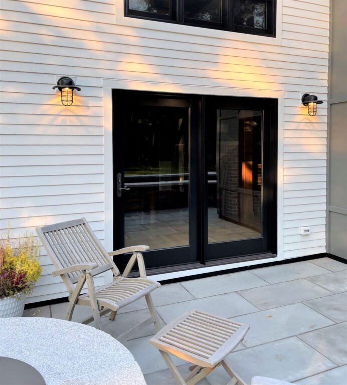 IMG 1725 residential exterior lighting on patio entryway Streamline LED Industrial Guard Sconce 106 Matte Black Warehouse Shade CGG Ribbed Glass Dusk to Dawn photocell