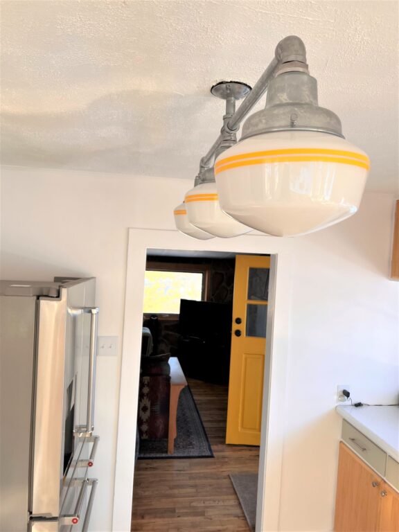 IMG 1261 residential interior lighting kitchen Primary Schoolhouse 3 Light Chandelier Small Opaque 975 Galvanized 18in arms 3in stem PB2 500 Buttery Yellow
